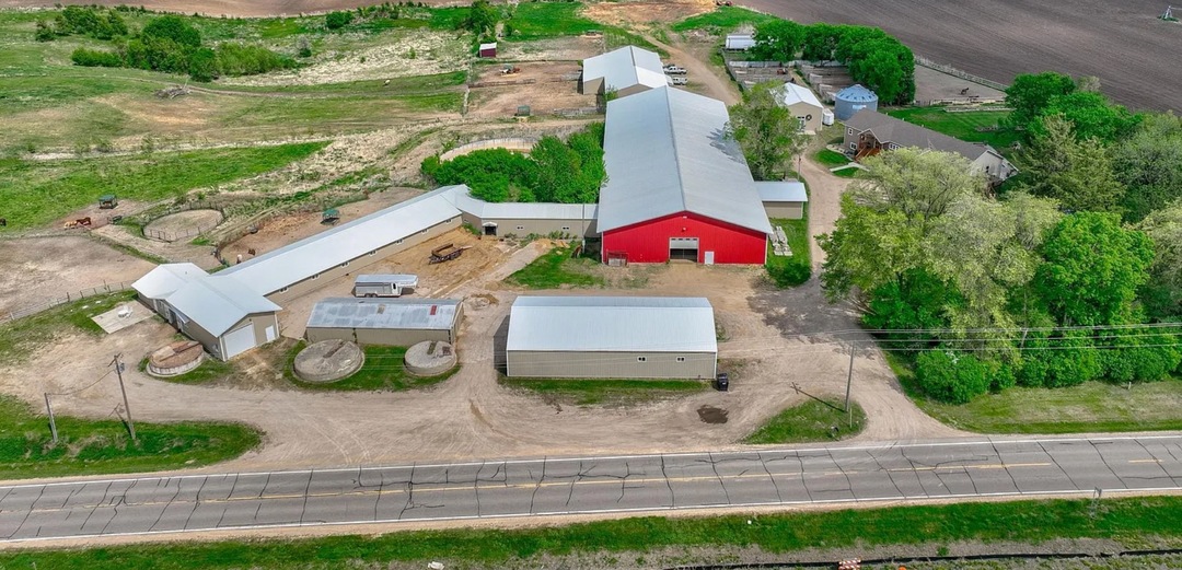 Drone view of EverRain Stables’ barns, riding arenas, and pastures visible from the highway in Rosemount, MN